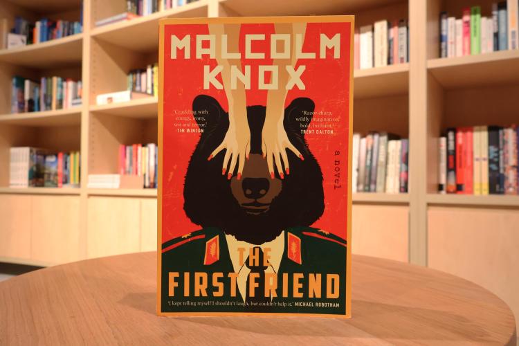 A copy of 'The First Friend' by Malcolm Knox on a table in a bookshop